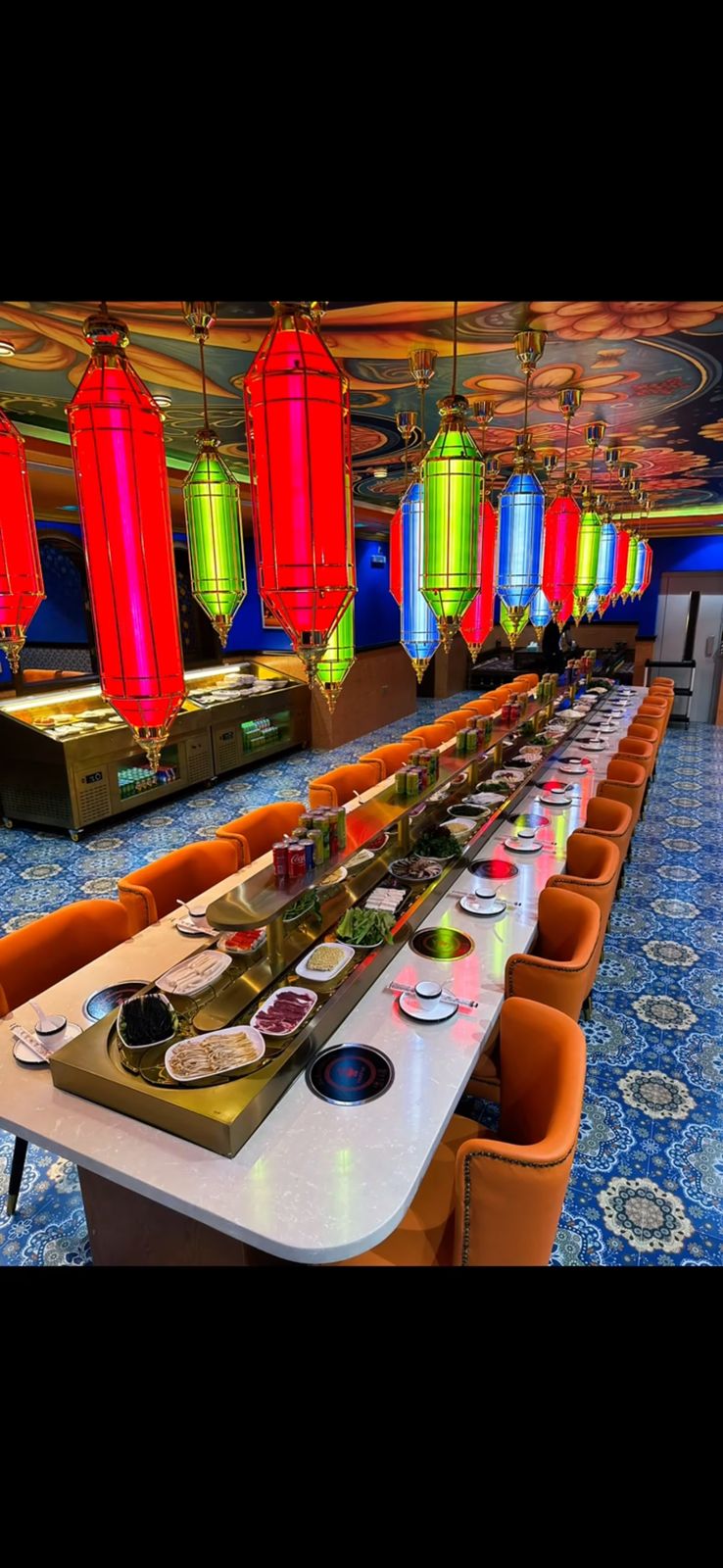 Mankai conveyor belt of hotpot ingredients with colorful lanterns