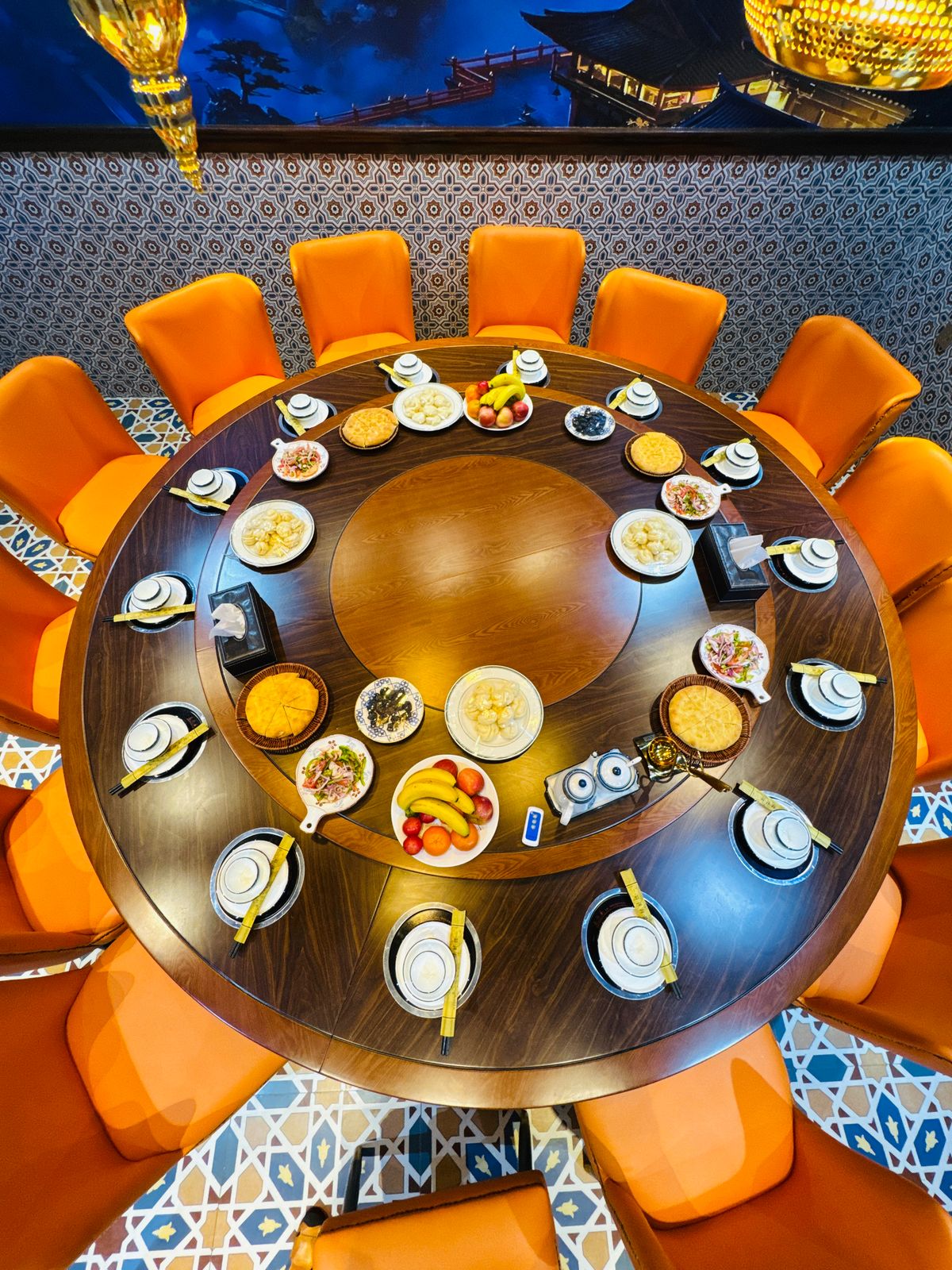 Round majlis table set with hotpot